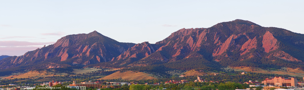 Boulder, CO with the Flatirons above. Courtesy of Flickr user thelightningman