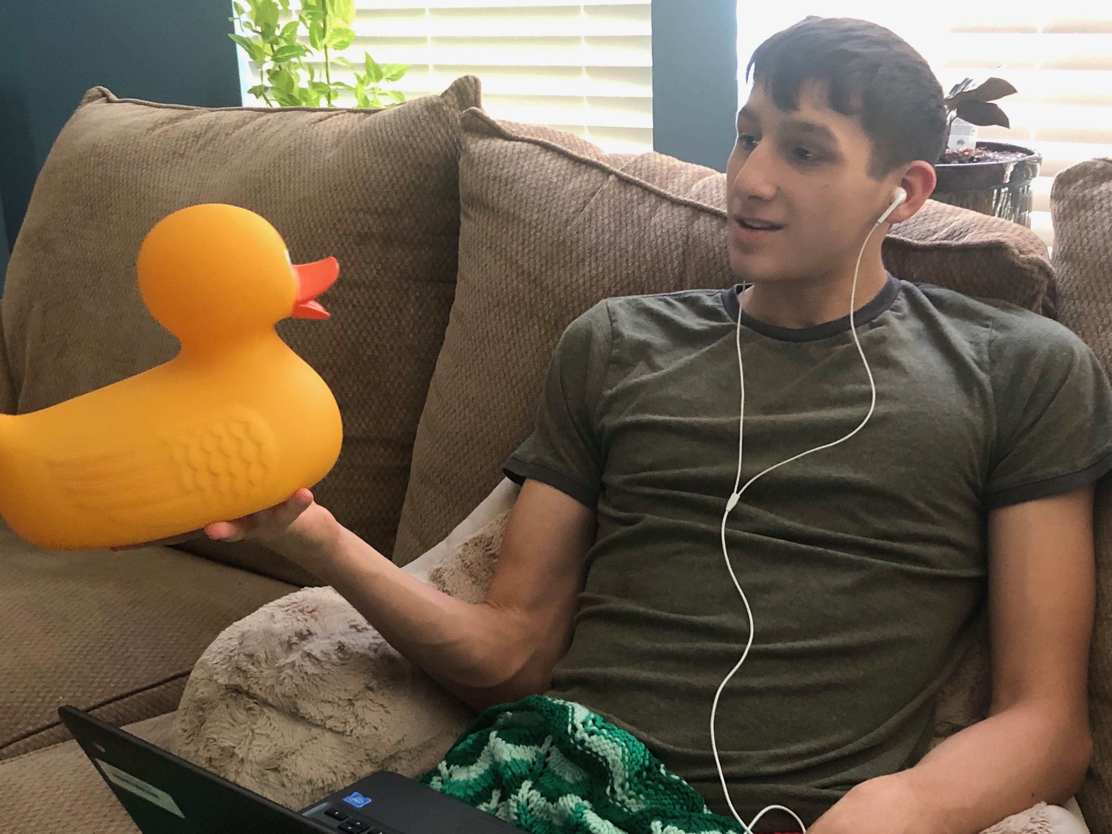 A coder talking to a rubber duck.